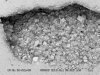 FIGURE A3-4 D. SEM photomicrograph of polymodal 
            decimicron- to centimicron-size planar-c dolomite lining a medium 
            vug in the Trenton Formation. The Fe concentration of this dolomite 
            is 8.98 wt.%, indicating saline basinal brine as the dolomitizing 
            fluid. Prudential 1A well, Marion County, OH, 1855 ft.